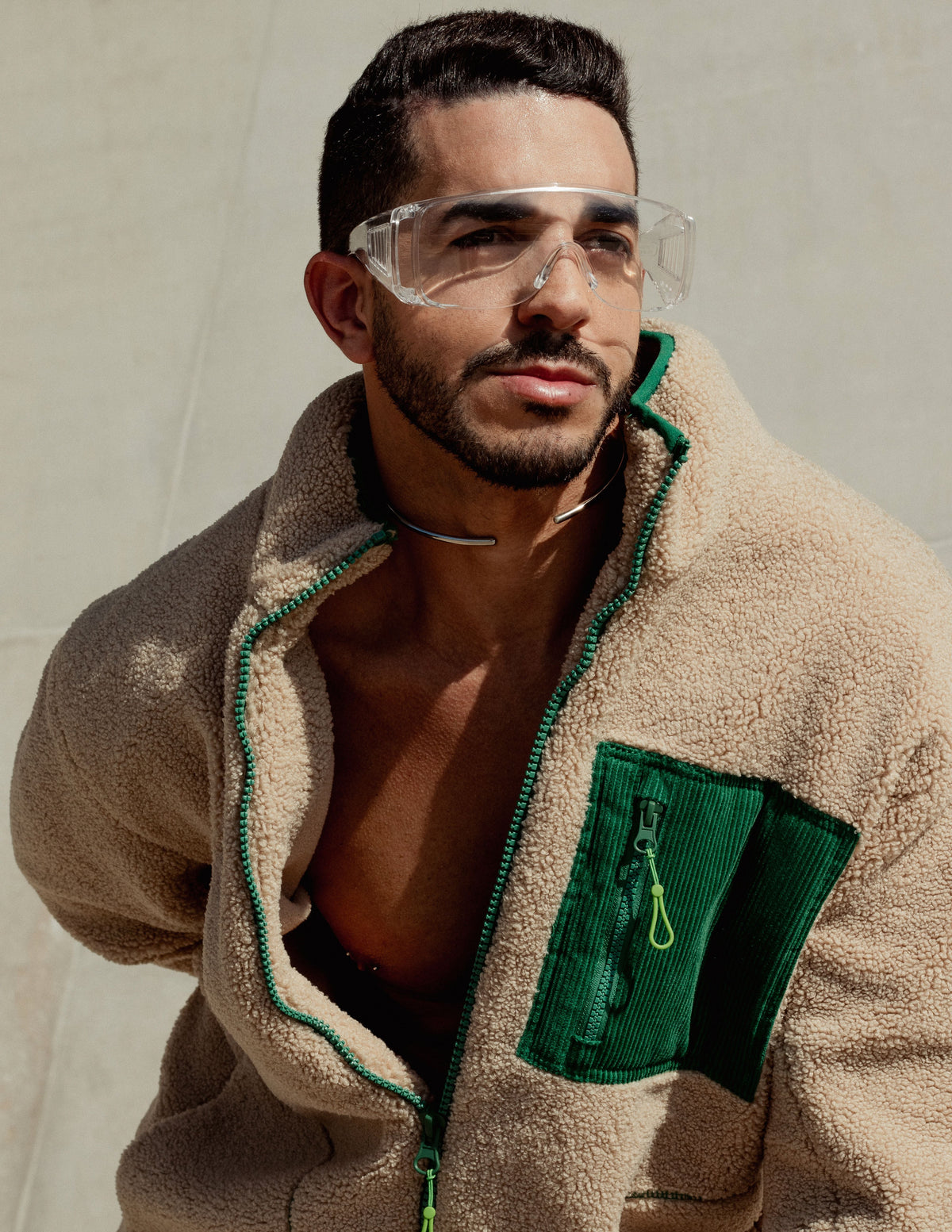 Person wearing a beige fleece jacket outdoors, illustrating pre-owned fleece outerwear