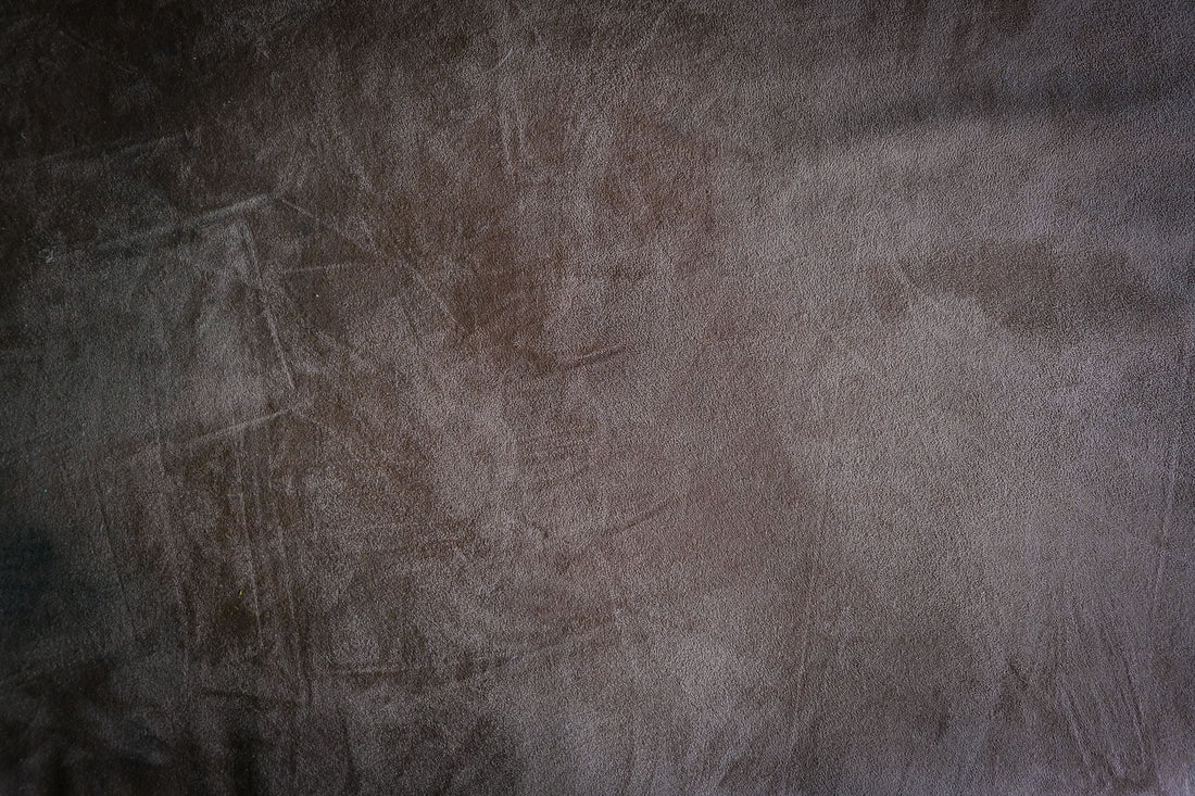 Close-up of rich jewel-toned velvet fabric texture in soft natural light